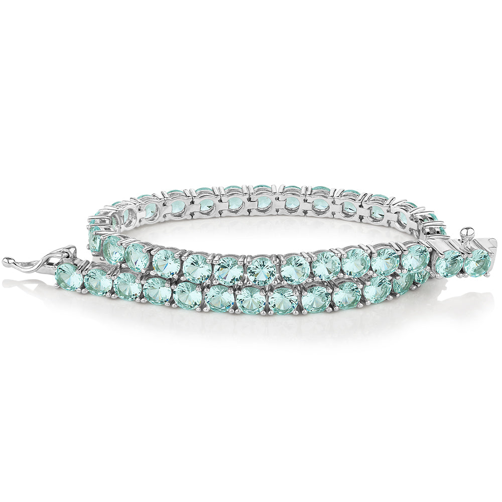 Round Brilliant tennis bracelet with ocean green simulants in sterling silver