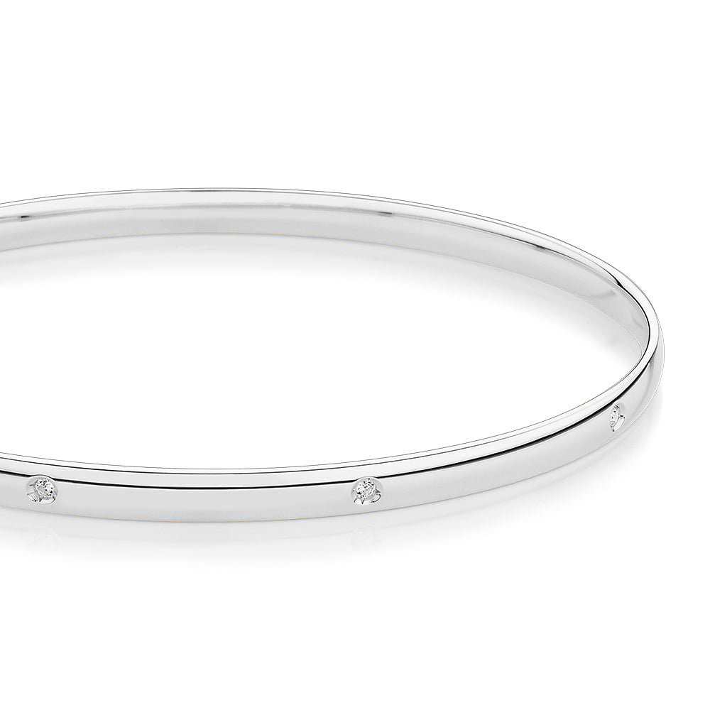 Oval bangle with diamond simulants in 10 carat white gold