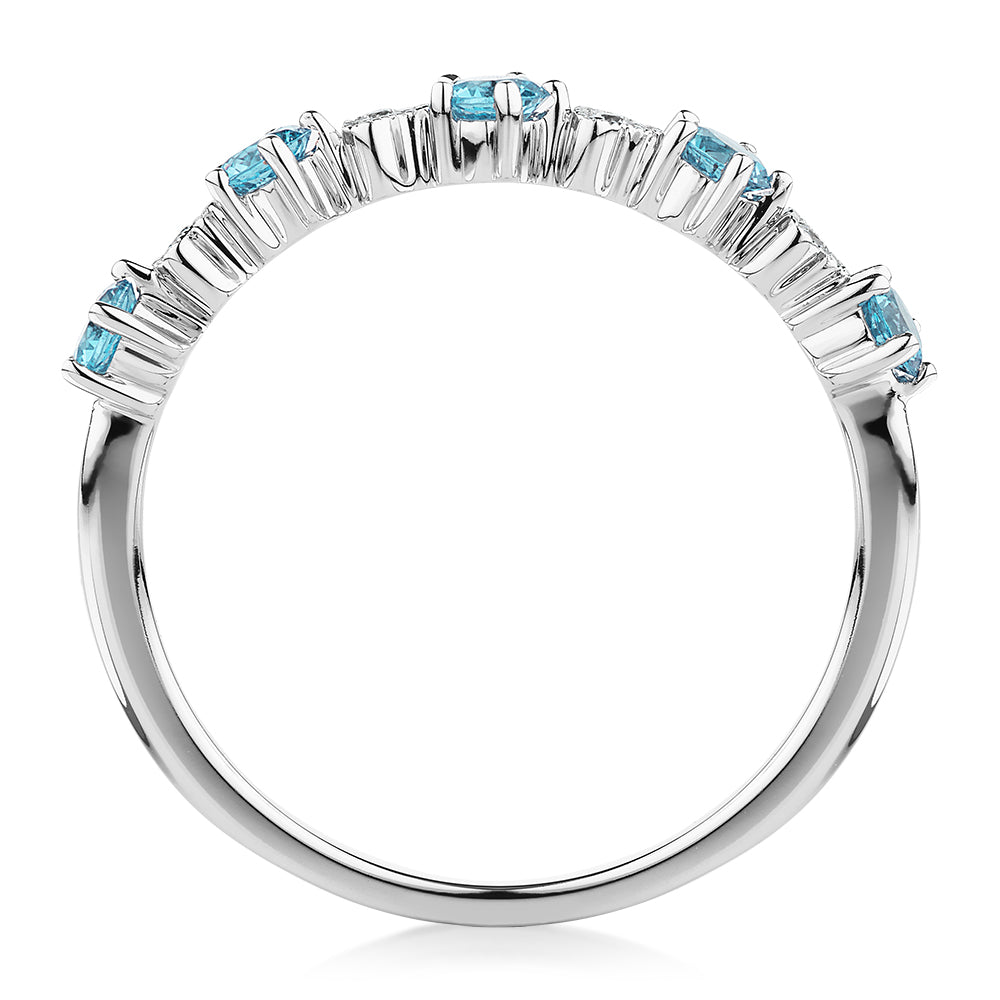 Wedding or eternity band with blue topaz and diamond simulants in 10 carat white gold