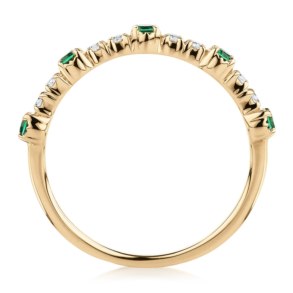 Wedding or eternity band with emerald and diamond simulants in 10 carat yellow gold