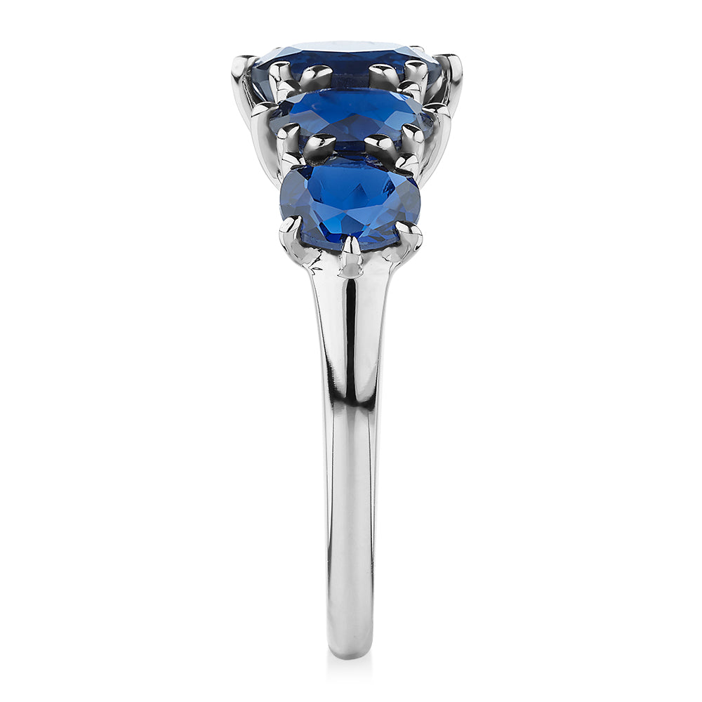 Dress ring with sapphire simulants in 10 carat white gold