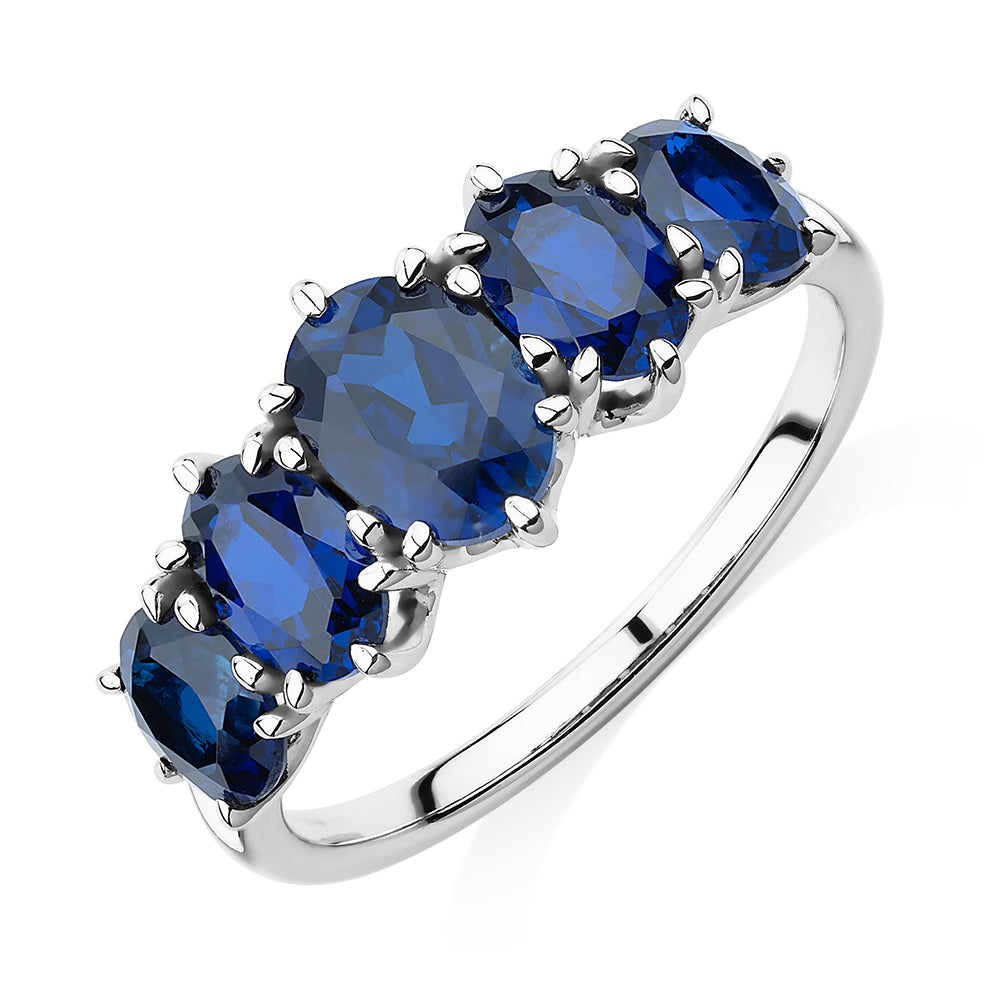 Dress ring with sapphire simulants in 10 carat white gold