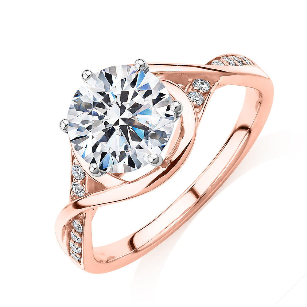 Round Brilliant shouldered engagement ring with 2.13 carats* of diamond simulants in 14 carat rose and white gold