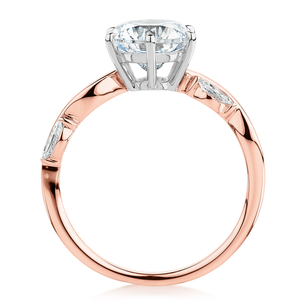 Round Brilliant and Marquise shouldered engagement ring with 2.44 carats* of diamond simulants in 14 carat rose and white gold