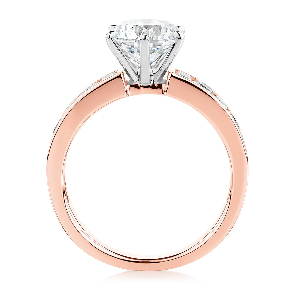 Round Brilliant and Baguette shouldered engagement ring with 2.72 carats* of diamond simulants in 14 carat rose and white gold