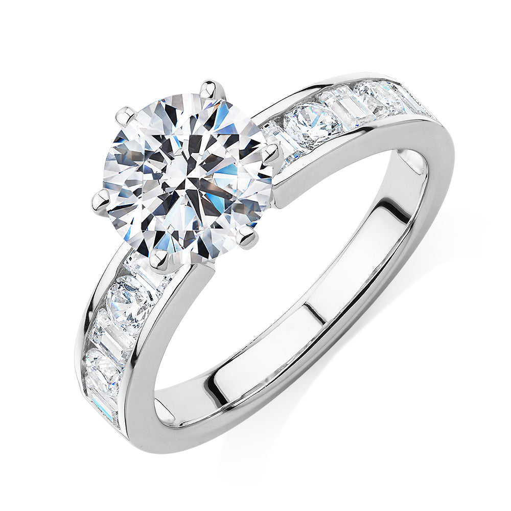 Round Brilliant and Baguette shouldered engagement ring with 2.72 carats* of diamond simulants in 14 carat white gold