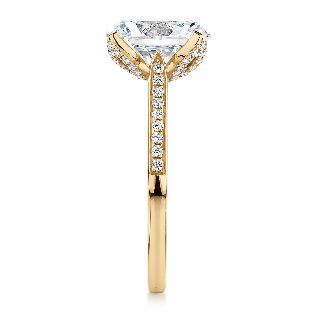 Oval and Round Brilliant shouldered engagement ring with 2.83 carats* of diamond simulants in 14 carat yellow gold