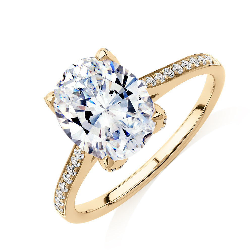 Oval and Round Brilliant shouldered engagement ring with 2.83 carats* of diamond simulants in 14 carat yellow gold