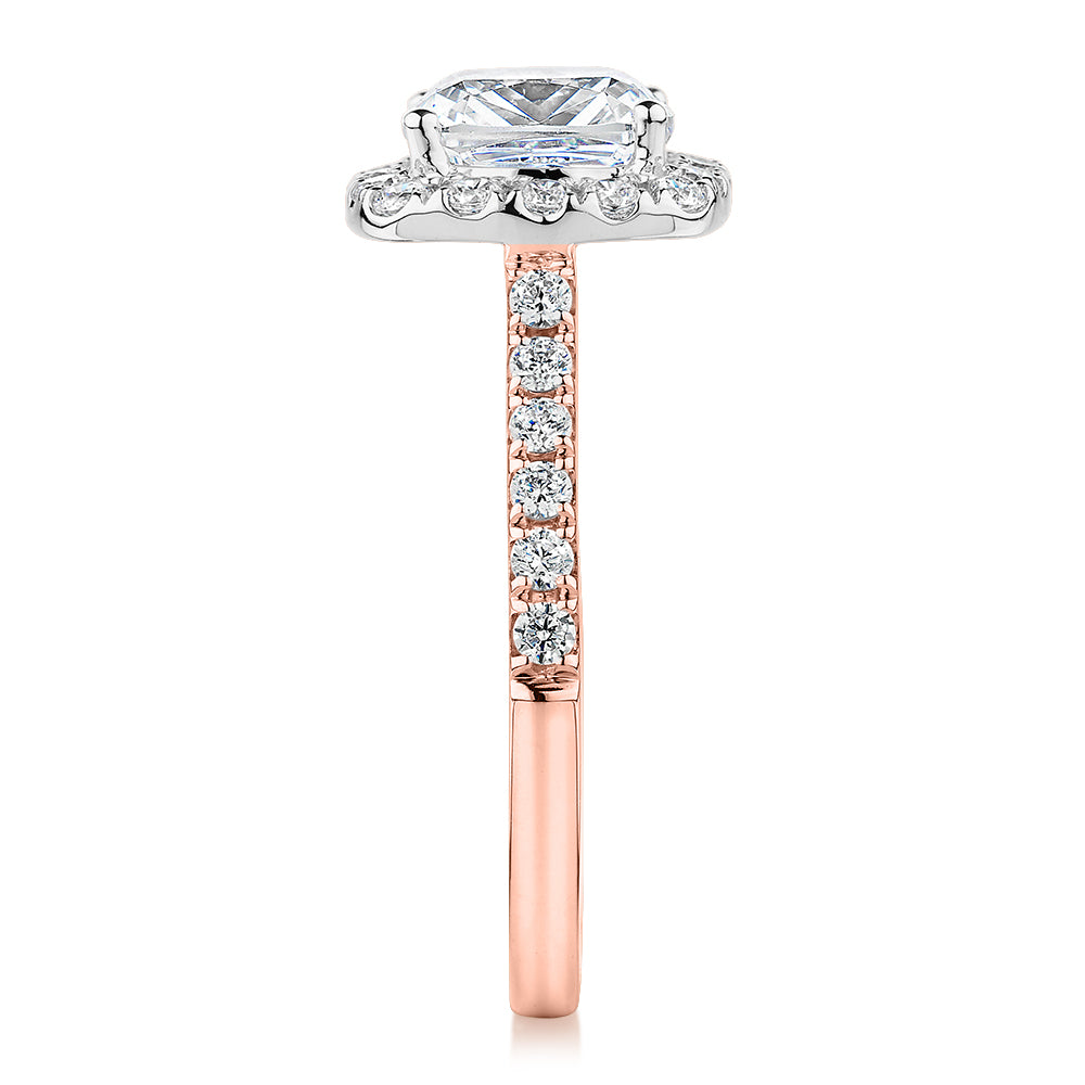 Cushion and Round Brilliant halo engagement ring with 2.09 carats* of diamond simulants in 10 carat rose and white gold