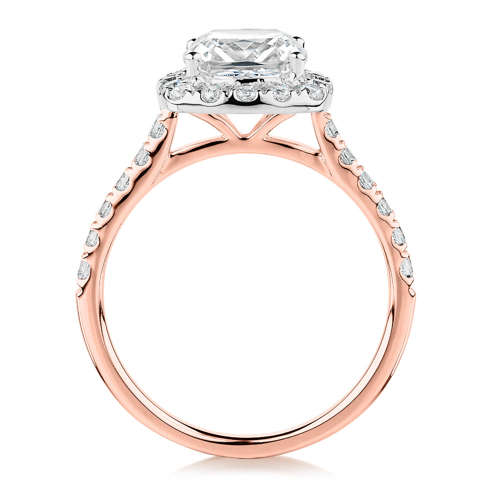 Cushion and Round Brilliant halo engagement ring with 2.09 carats* of diamond simulants in 10 carat rose and white gold