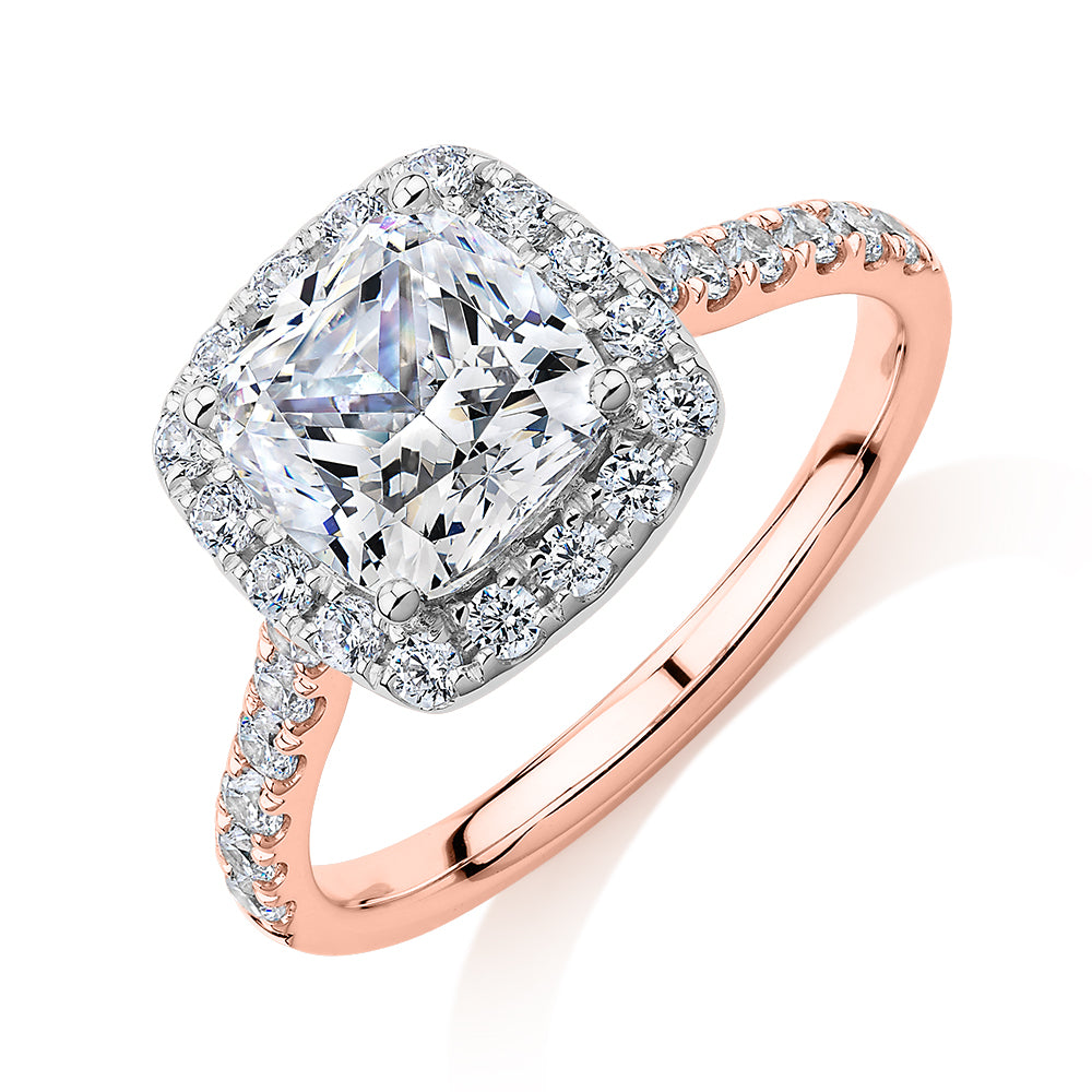 Cushion and Round Brilliant halo engagement ring with 2.09 carats* of diamond simulants in 10 carat rose and white gold