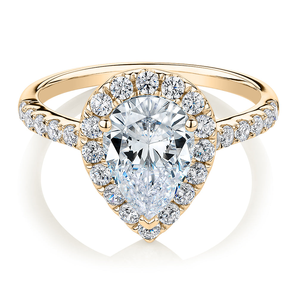 Pear and Round Brilliant halo engagement ring with 2.38 carats* of diamond simulants in 10 carat yellow gold