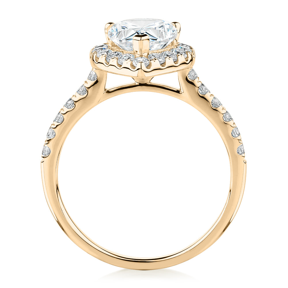 Pear and Round Brilliant halo engagement ring with 2.38 carats* of diamond simulants in 10 carat yellow gold