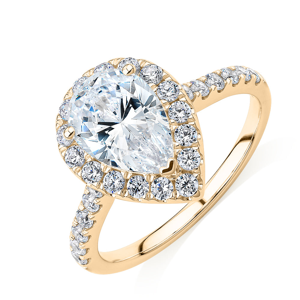 Pear and Round Brilliant halo engagement ring with 2.38 carats* of diamond simulants in 10 carat yellow gold