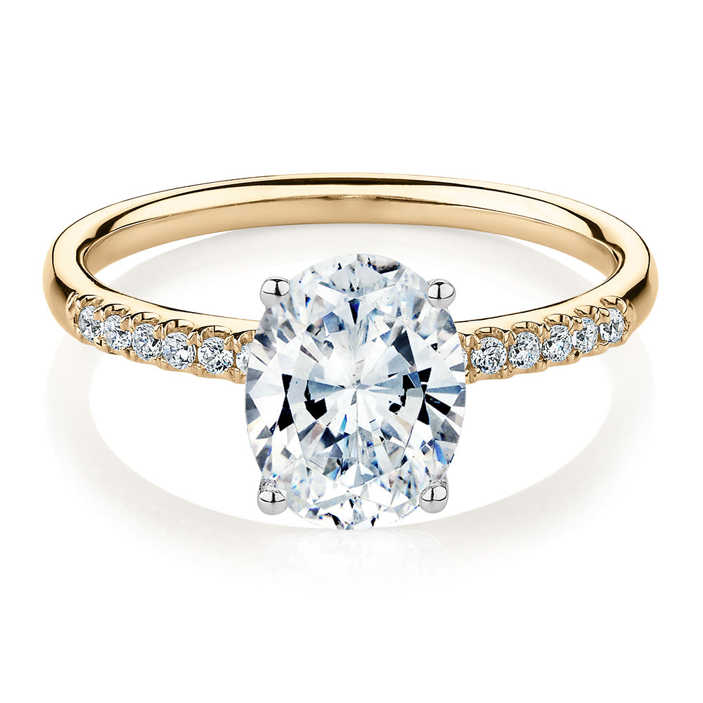 Oval and Round Brilliant shouldered engagement ring with 1.94 carats* of diamond simulants in 14 carat yellow and white gold