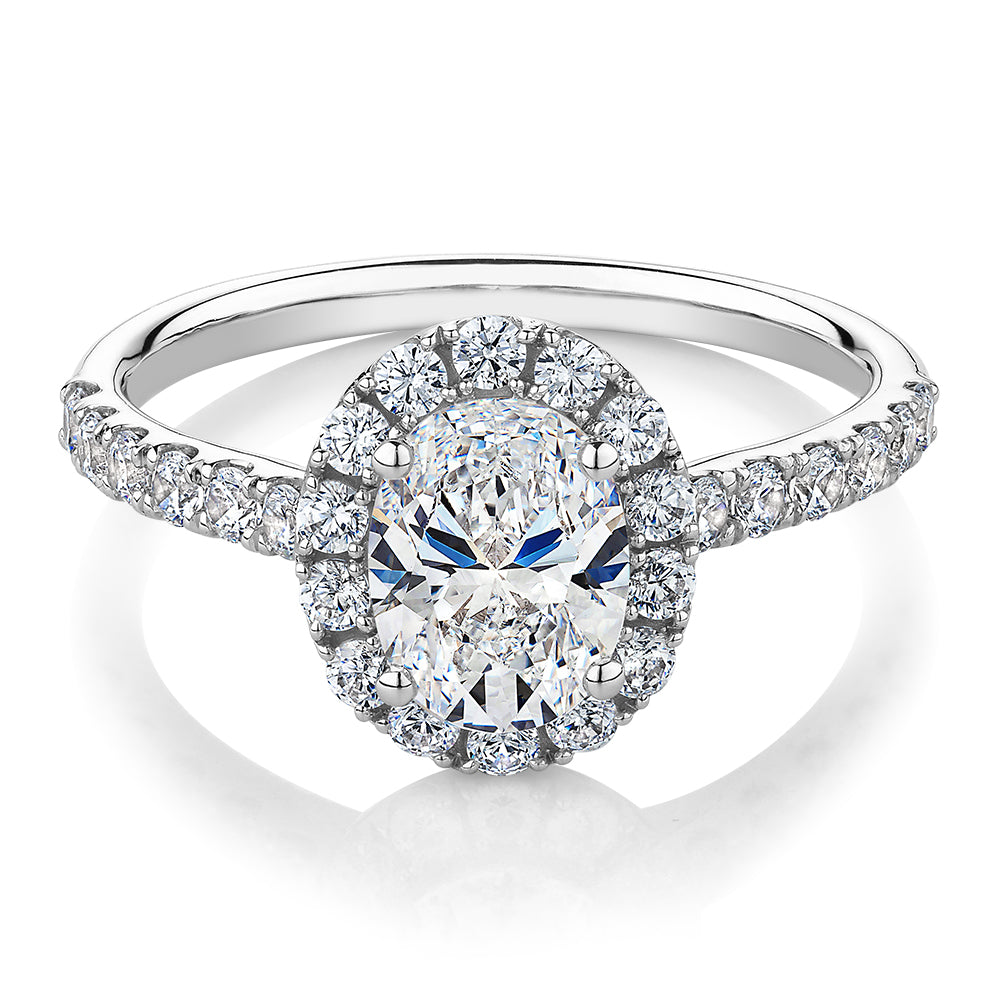 Oval and Round Brilliant halo engagement ring with 1.79 carats* of diamond simulants in 14 carat white gold