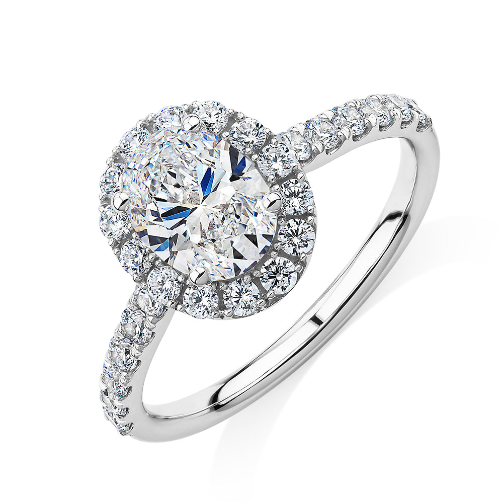 Oval and Round Brilliant halo engagement ring with 1.79 carats* of diamond simulants in 14 carat white gold