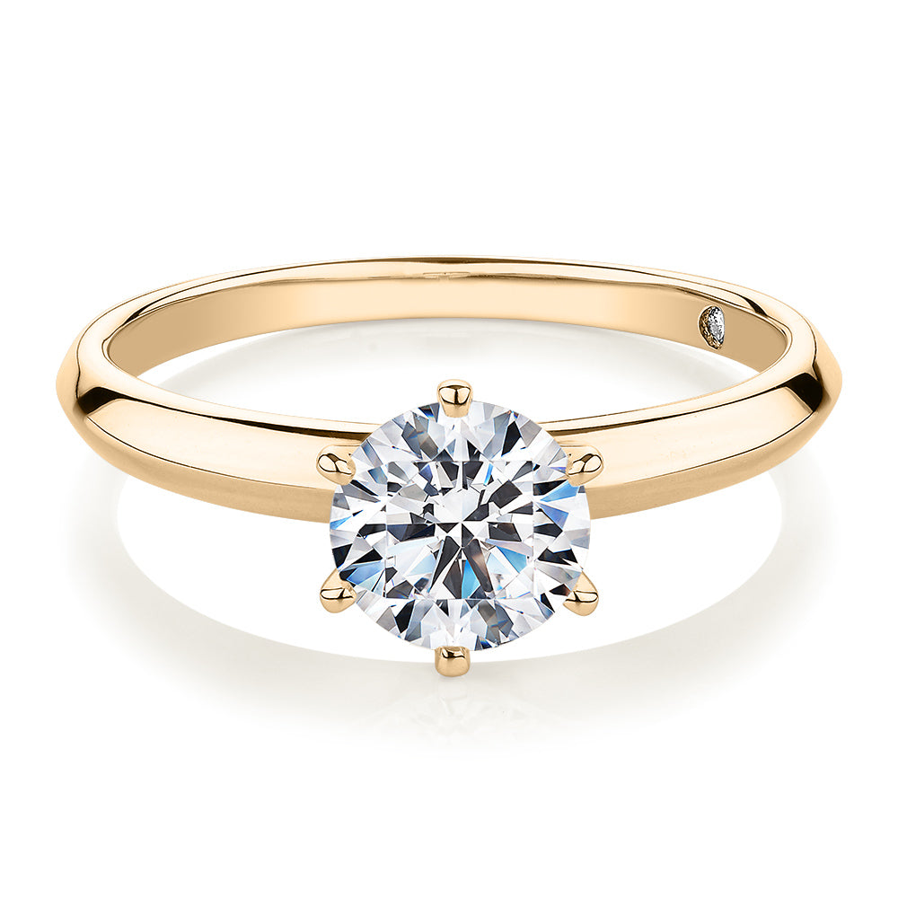 Round Brilliant solitaire engagement ring with 1 carat* diamond simulant in 14 carat yellow gold
