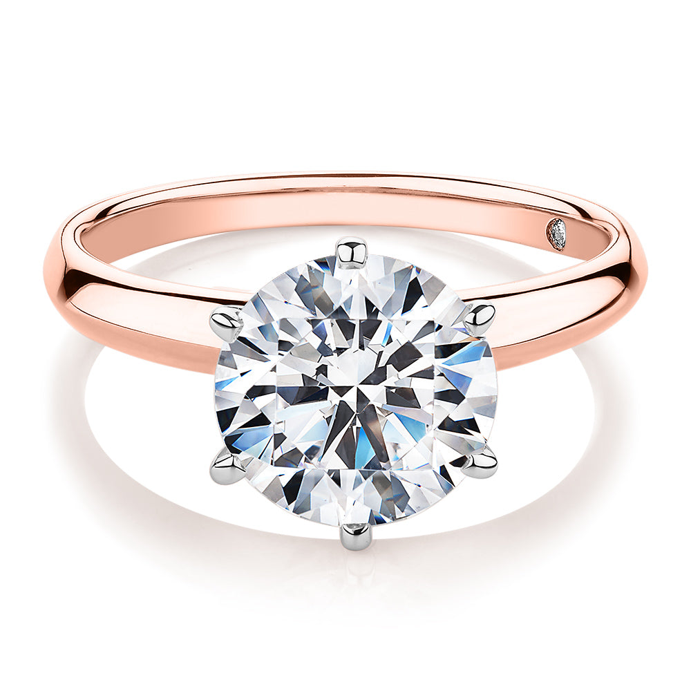 Round Brilliant solitaire engagement ring with 3 carat* diamond simulant in 14 carat rose and white gold