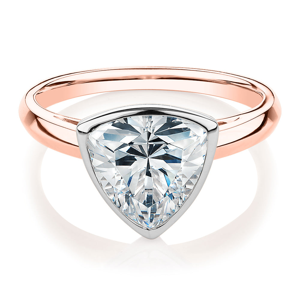 Trilliant solitaire engagement ring with 2.15 carat* diamond simulant in 14 carat rose and white gold