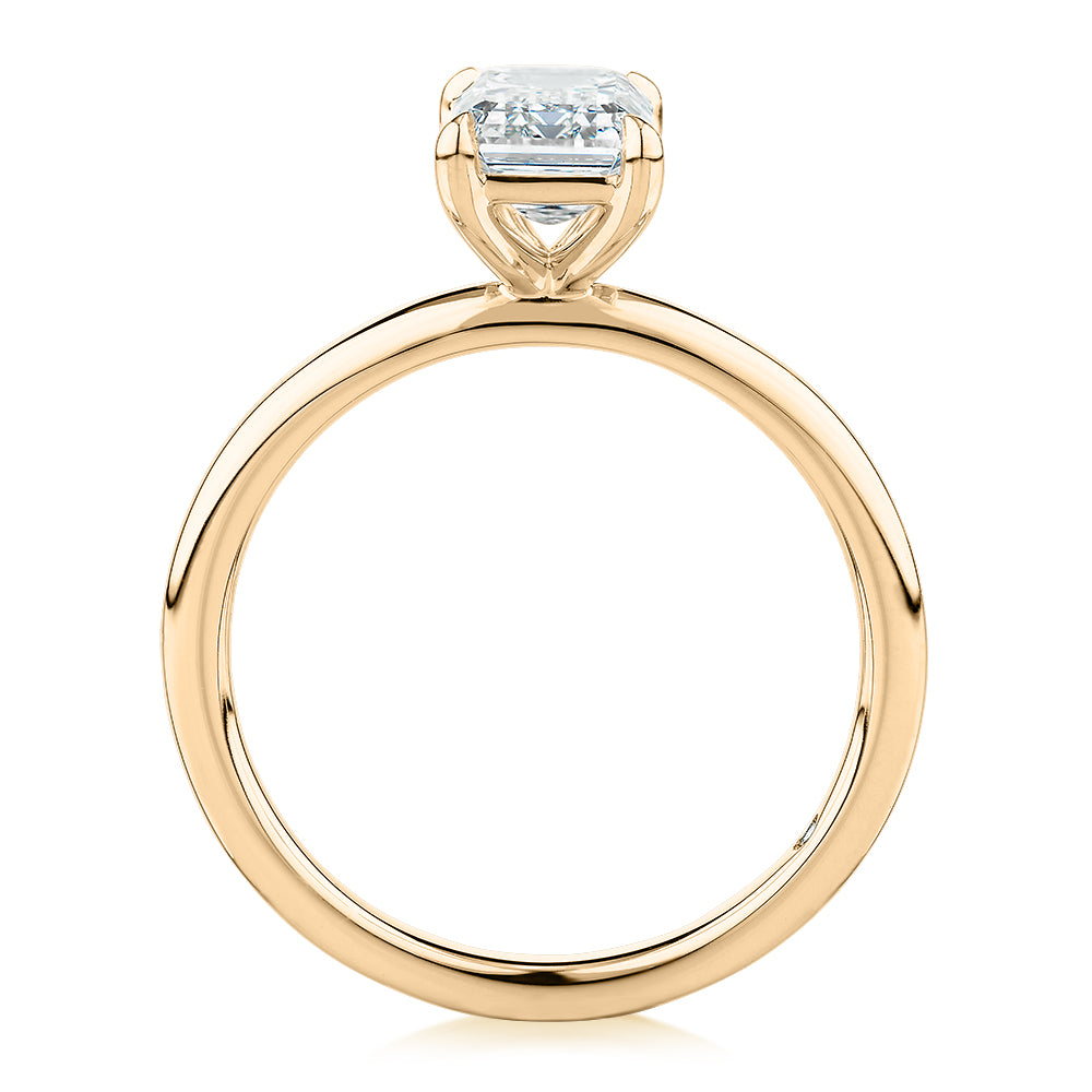 Signature Simulant Diamond 1.50 carat* emerald cut solitaire engagement ring in 14 carat yellow gold