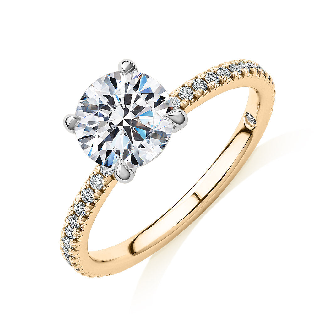 Signature Simulant Diamond 1.74 carat* TW round brilliant shouldered engagement ring in 14 carat yellow and white gold