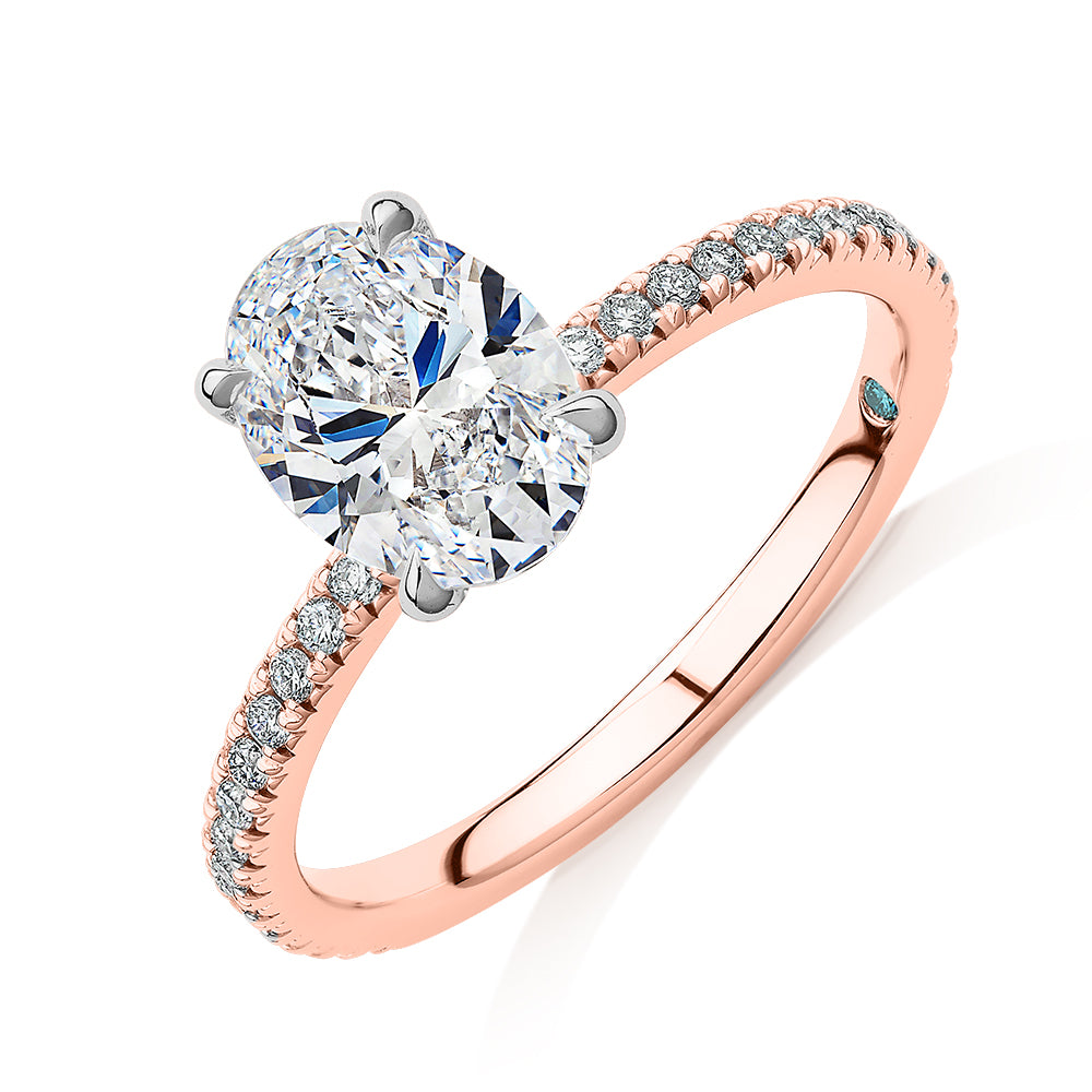 Premium Certified Lab-Grown Diamond, 1.74 carat TW oval and round brilliant shouldered engagement ring in 14 carat rose and white gold