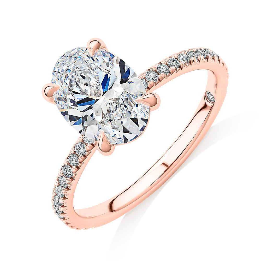 Signature Simulant Diamond 2.24 carat* TW oval and round brilliant shouldered engagement ring in 14 carat rose gold