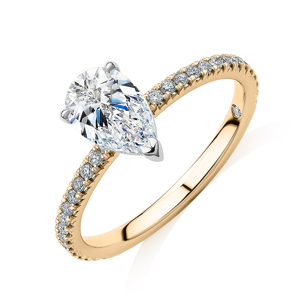 Signature Simulant Diamond 1.24 carat* TW pear and round brilliant shouldered engagement ring in 14 carat yellow and white gold