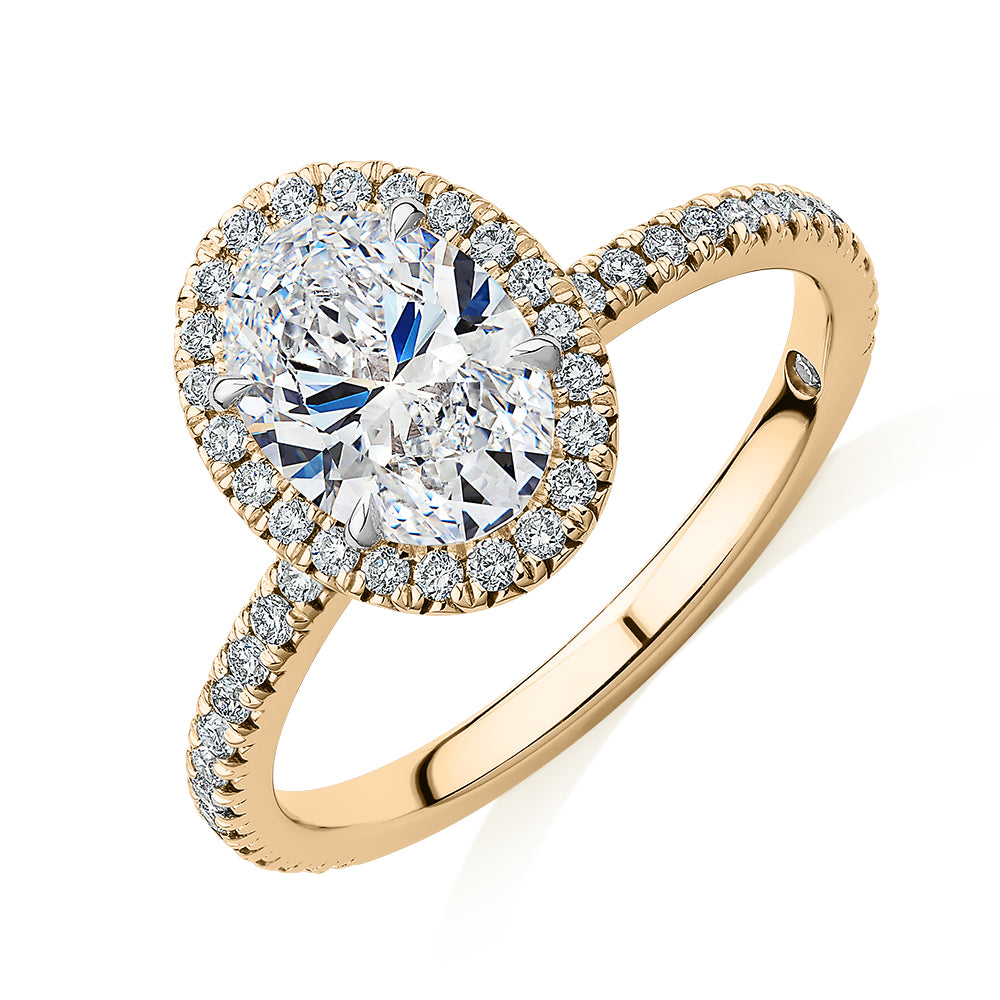 Signature Simulant Diamond 1.89 carat* TW oval and round brilliant halo engagement ring in 14 carat yellow and white gold