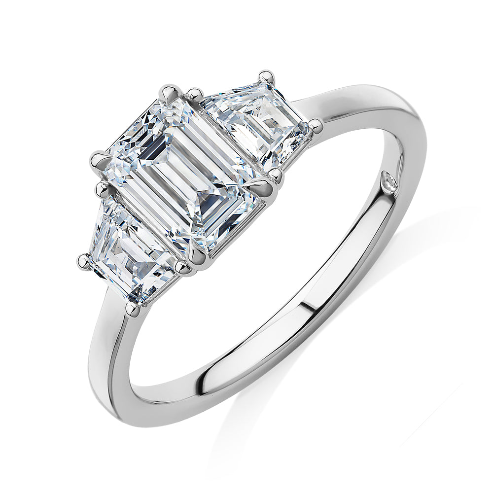 Signature Simulant Diamond 1.87 carat* TW emerald cut three stone ring in 14 carat white gold