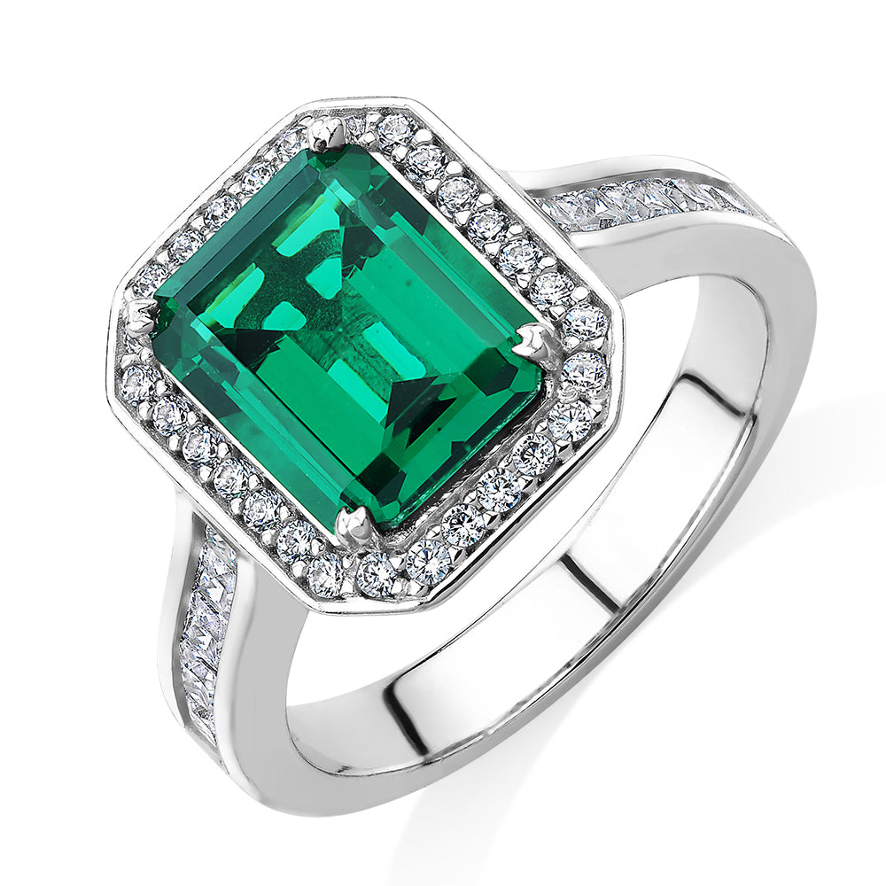 Dress ring with emerald simulant and 0.78 carats* of diamond simulants in sterling silver