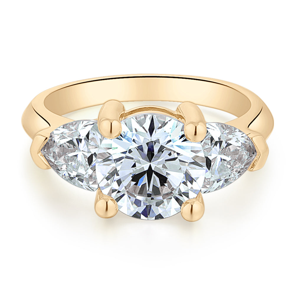 Three stone ring with 4.15 carats* of diamond simulants in 10 carat ye ...