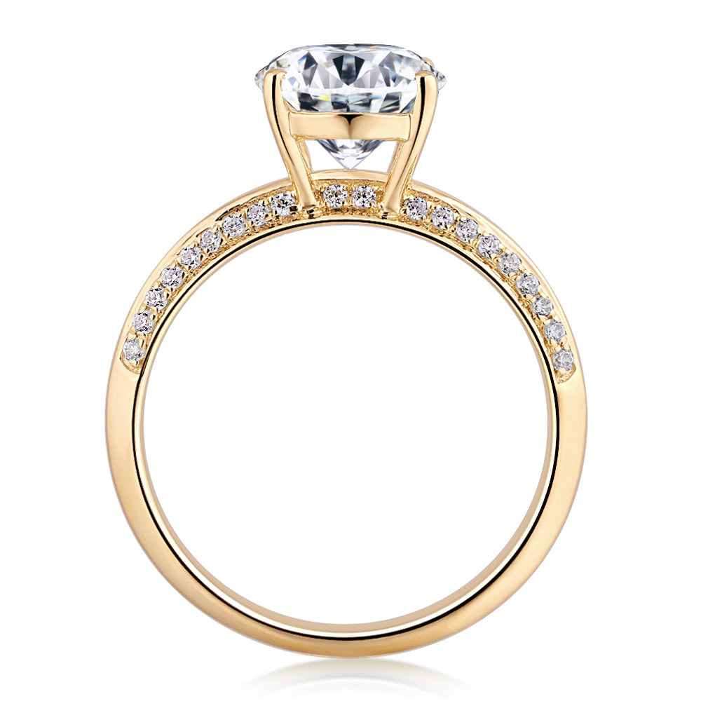 Oval and Round Brilliant shouldered engagement ring with 2.74 carats* of diamond simulants in 14 carat yellow gold