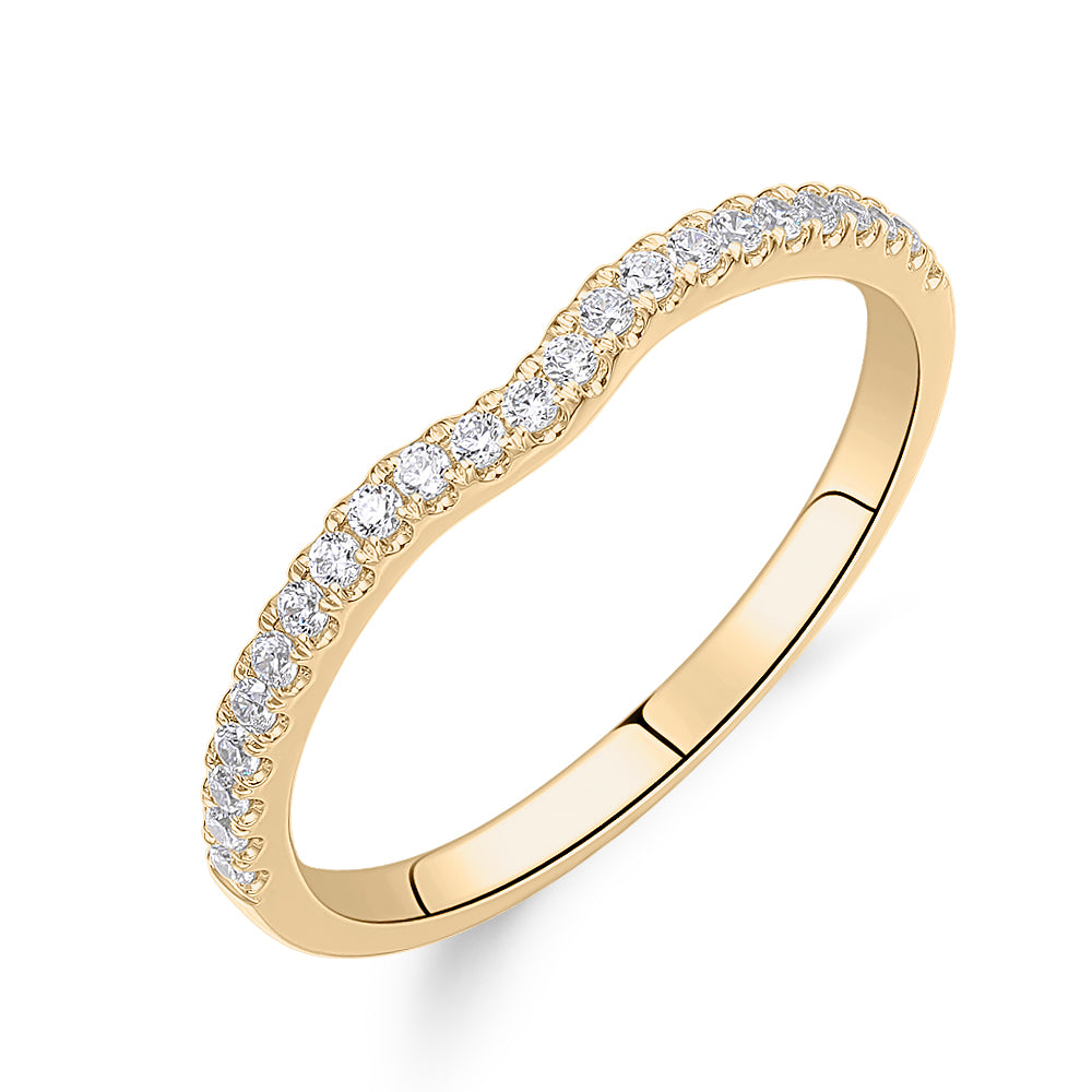 Round Brilliant curved wedding or eternity band in 14 carat yellow gold