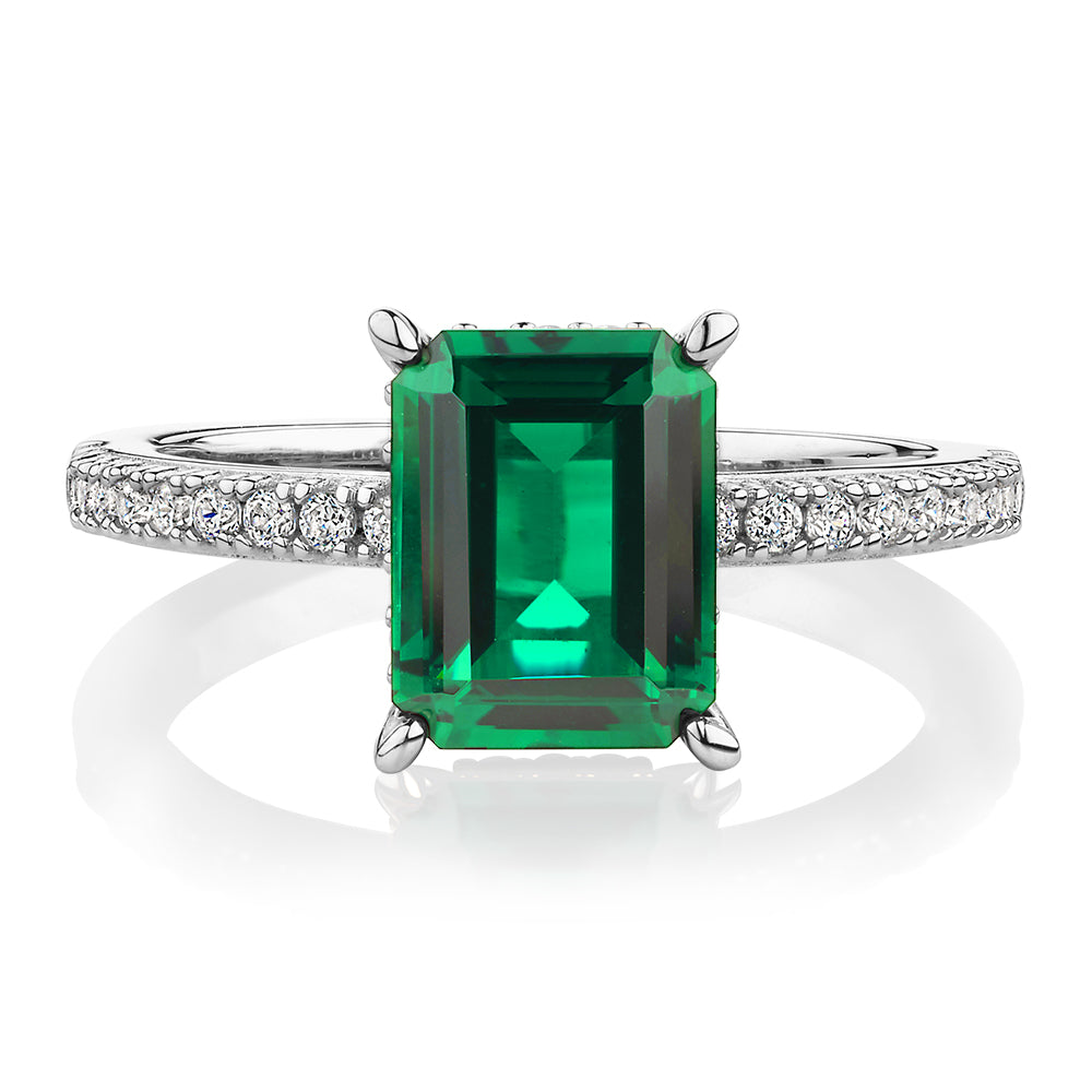 Dress ring with emerald simulant and 0.26 carats* of diamond simulants in sterling silver