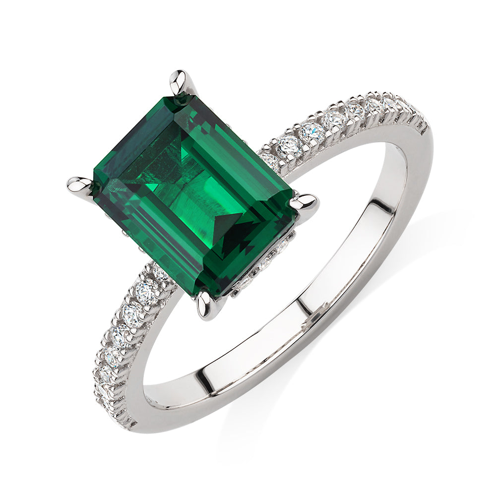 Dress ring with emerald simulant and 0.26 carats* of diamond simulants in sterling silver