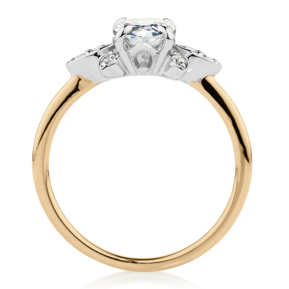 Pear and Round Brilliant shouldered engagement ring with 1.8 carats* of diamond simulants in 14 carat yellow and white gold