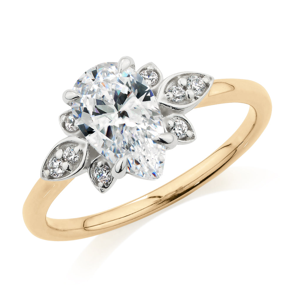 Pear and Round Brilliant shouldered engagement ring with 1.8 carats* of diamond simulants in 14 carat yellow and white gold