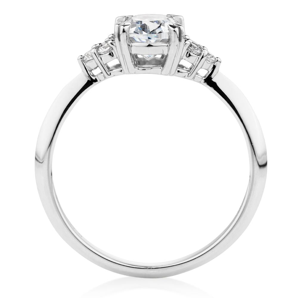 Oval and Round Brilliant shouldered engagement ring with 1.3 carats* of diamond simulants in 14 carat white gold