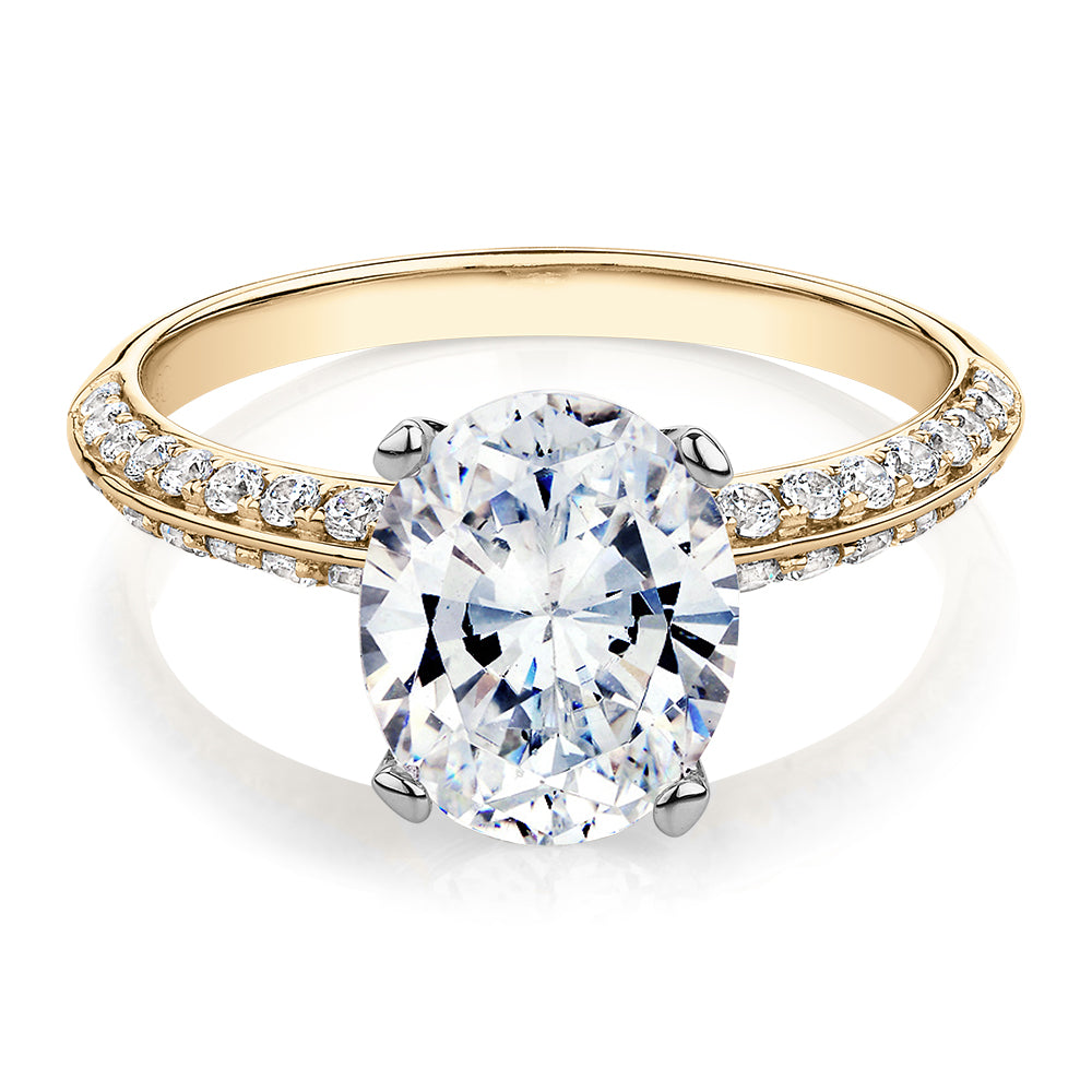 Oval shouldered engagement ring with 2.97 carats* of diamond simulants in 14 carat yellow and white gold
